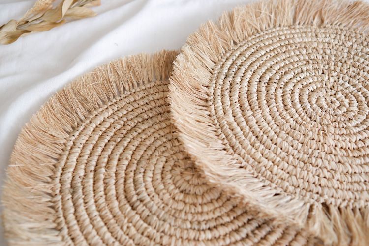 Boho fringe raffia placemat with natural fibers, perfect for adding rustic, eco-friendly charm to dining table settingsHandwoven boho fringe raffia placemat with natural fibers, perfect for adding rustic, eco-friendly charm to dining table settings