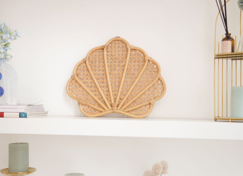 Handcrafted Rattan Seashell Wall Decor, ideal for instilling boho-chic rattan vibe in nurseries, adding shell elements to nursery rooms, bohemian shelf setup, beach-themed house interiors, and coastal girls' bedrooms