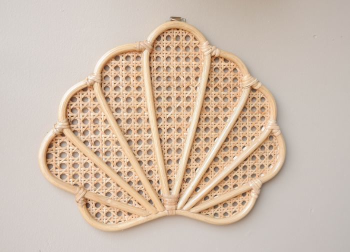 Rattan Seashell Wall Decor, a sublime choice for boho rattan nursery embellishments, shell nursery accessories, bohemian shelf additions, beachy home decor elements, and coastal girls' bedroom decor.