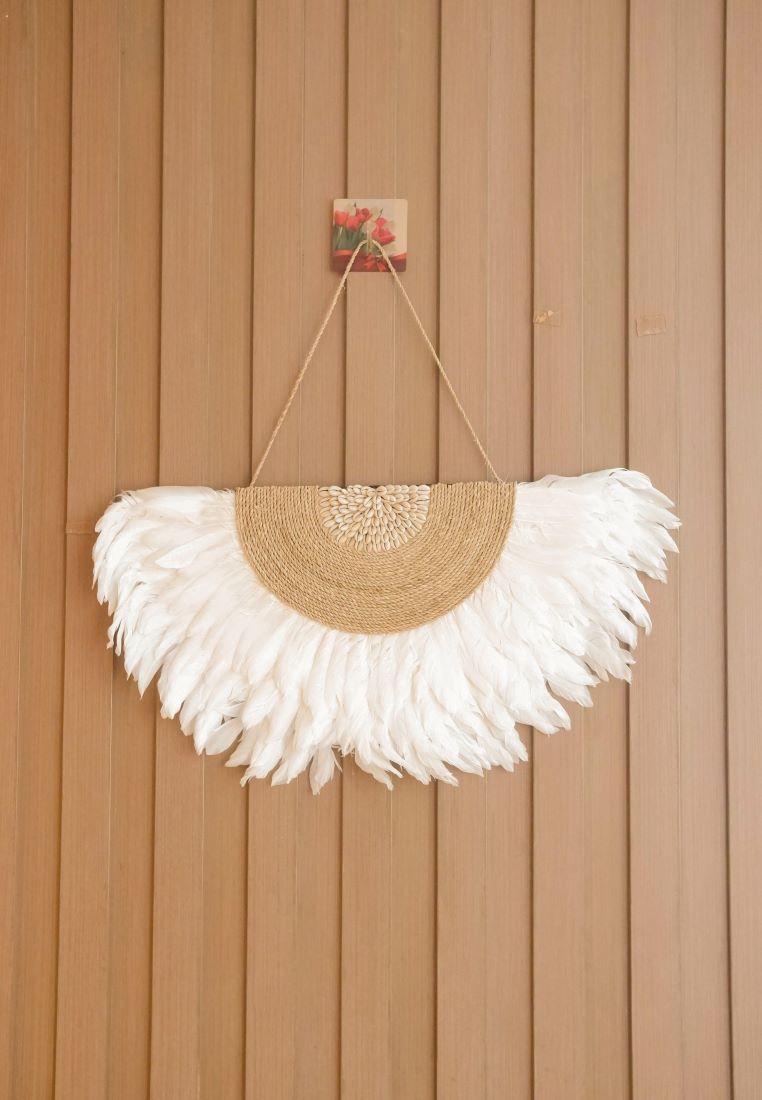 White Juju Hat Wall Decor featuring soft feathers and sea shell accents, perfect for boho beach bedroom, living room decor. Adds a natural, coastal vibe to any space with its textured, handcrafted design.